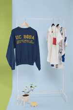 A UC Boba Sweater Being Hung on a Rack