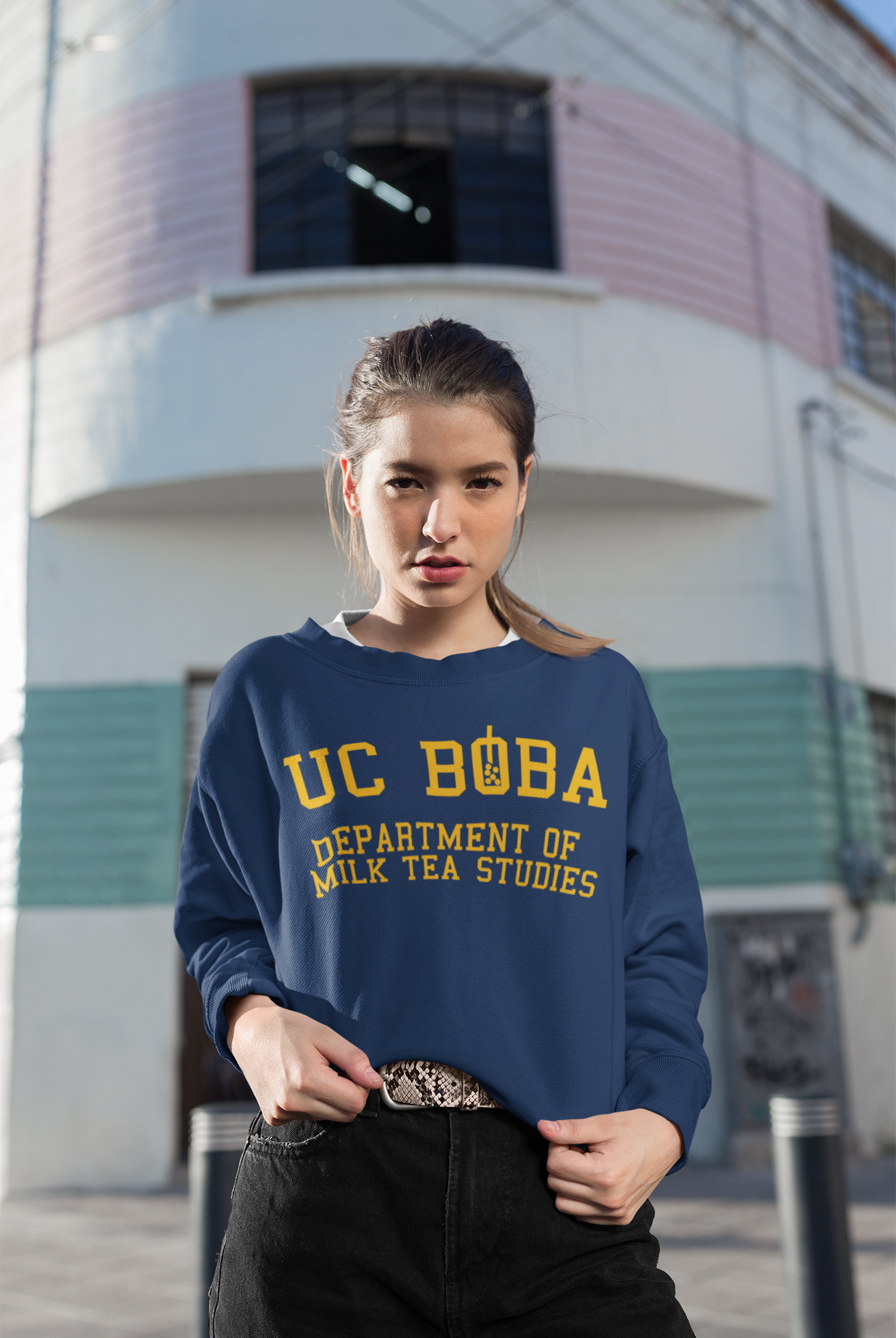 Woman wearing a UC Boba Shirt who likes bubble tea and milk tea