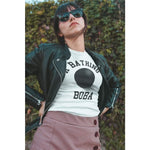 Woman wearing sunglasses and a bathing boba shirt