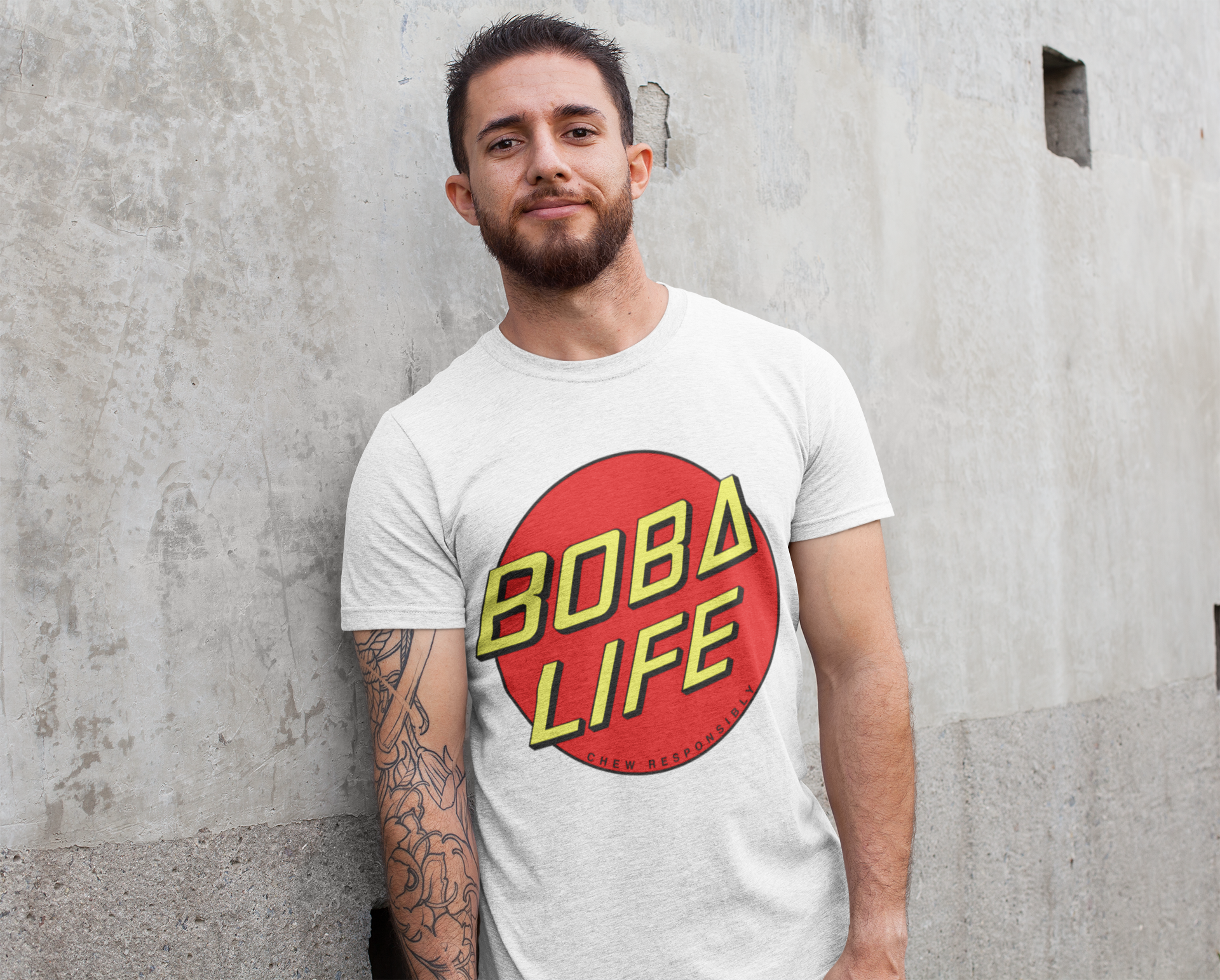 Man wearing a Boba Life T-Shirt against a wall