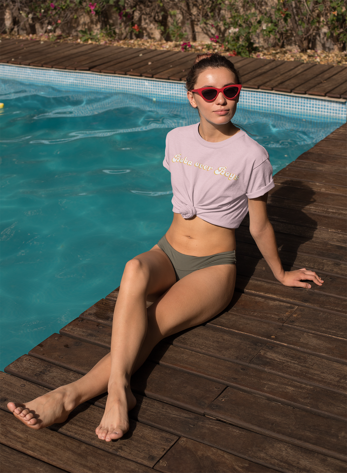 Woman wearing Boba over Boys boba shirt by the pool