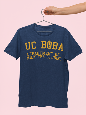 A Hand Holding a Boba Shirt on a Hanger