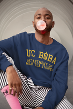 A Trendy Man Wearing a UC Boba Sweatshirt Blowing Bubble gum