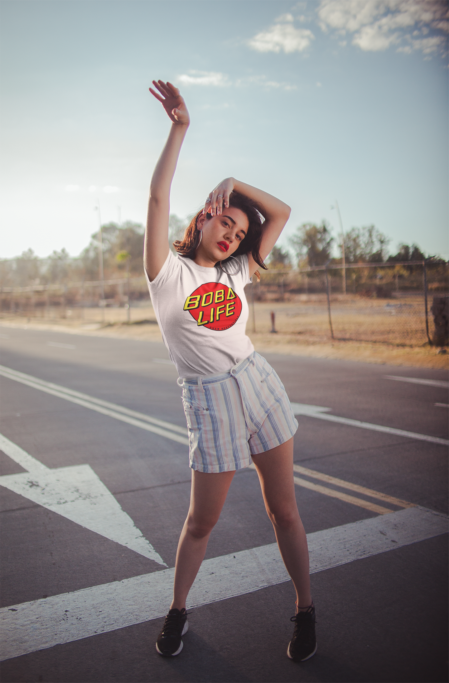 Woman wearing a Boba Life T-shirt looking cool