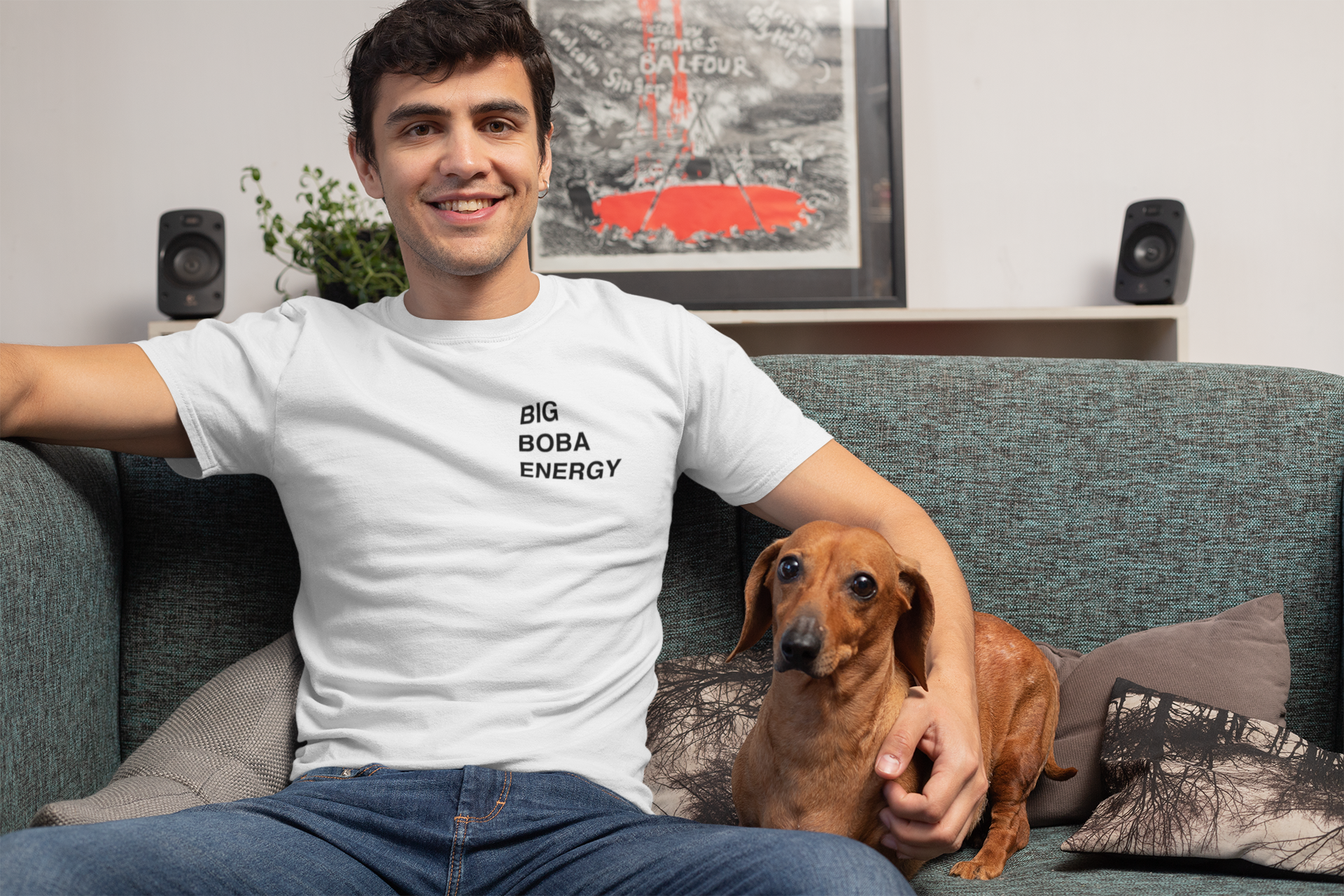 Man wearing a Big Boba Energy Shirt holding a dog