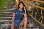 Woman wearing UC Boba Shirt on stairs